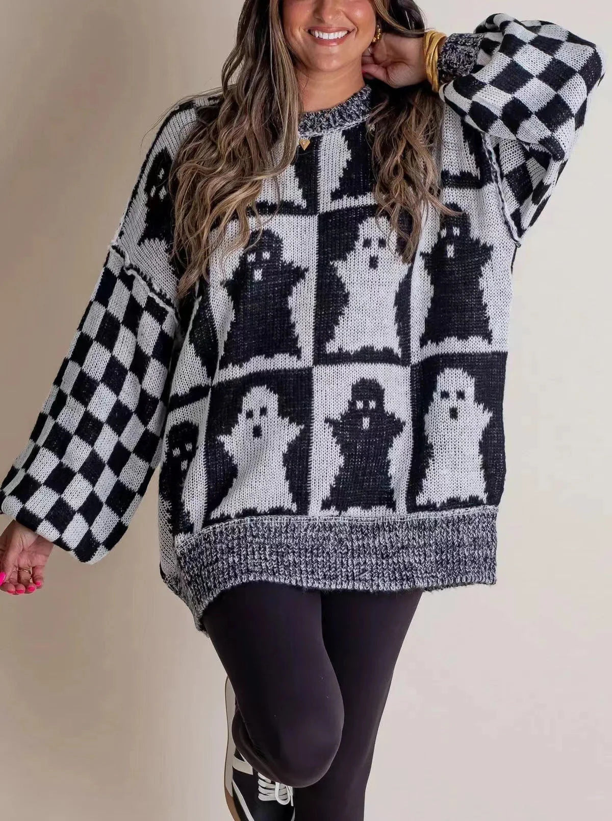 A stylish Halloween sweater featuring a unique pumpkin and ghost graphic design, available in a variety of fashion-forward colors.
