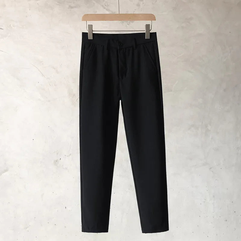 Boys slim straight wool trousers in a tapered fit, shown in a light grey colour.