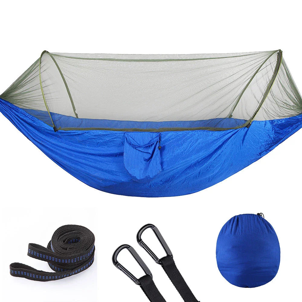 Cozy outdoor hammock with mosquito net for relaxing in nature and outdoor adventures