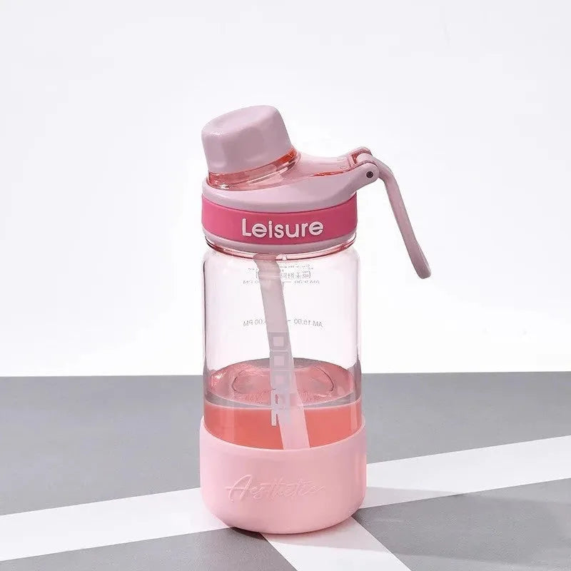 Grey portable plastic cup with built-in straw, shown in 1000ml size with modern cylindrical design.