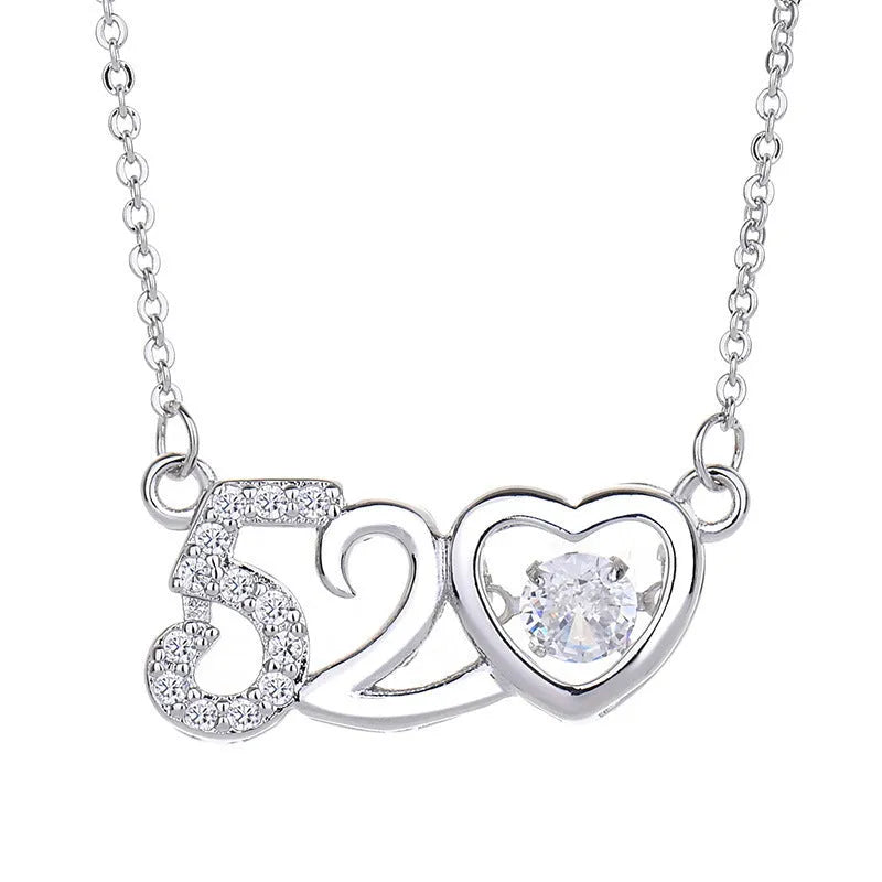 Sterling silver heart-shaped pendant necklace with a small crown and bow design, shown in a rose gold finish.