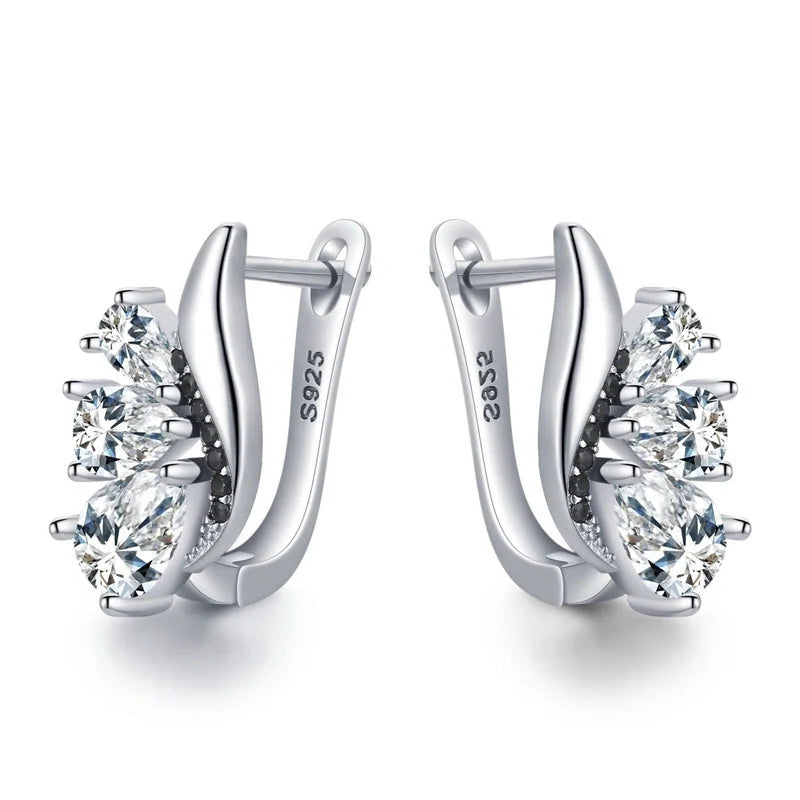 Elegant wing-shaped earrings with drop-shaped zircon stones, crafted with copper for a sophisticated and fashionable look