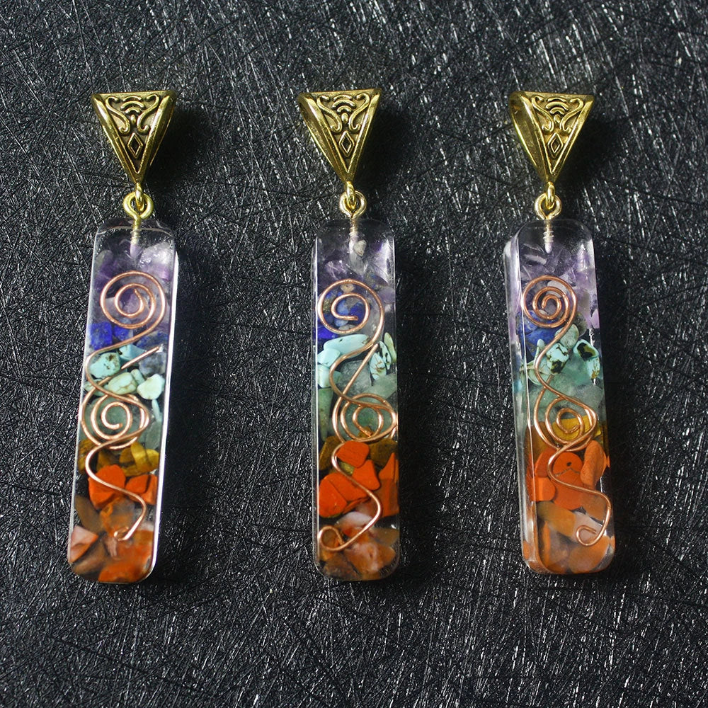 A stylish 7-chakra crystal pendant featuring a unique geometric design and natural stone patterns