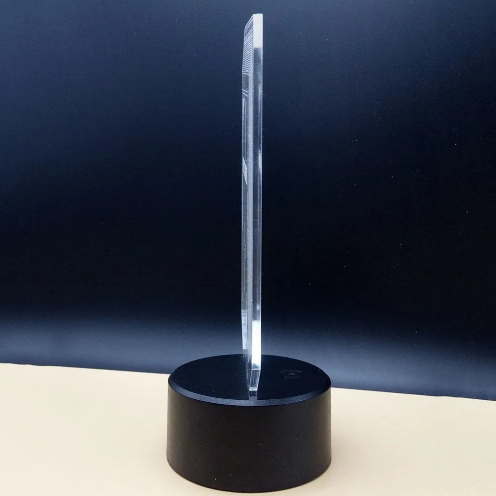 Brain-shaped 3D acrylic LED desk lamp on ABS base with remote control, showing colourful light projection.