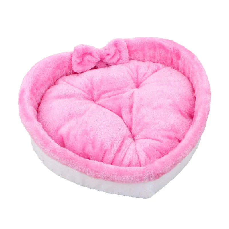 Cozy heart-shaped pet bed in grey and pink colors, suitable for cats and small dogs