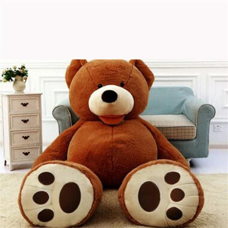 A giant, plush teddy bear in a variety of sizes and colors, including light brown, dark brown, gray, white, pink, and purple.