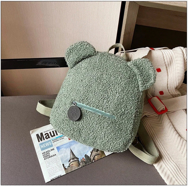 Adorable bear-shaped backpack made of soft, cozy fleece material in multiple color options for children and women