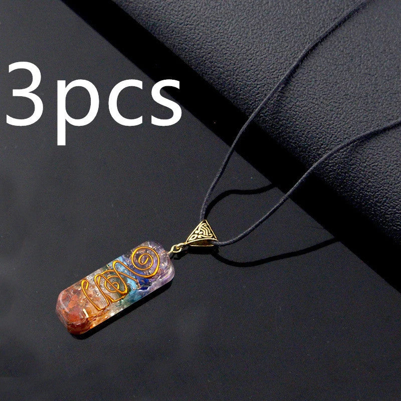 A stylish 7-chakra crystal pendant featuring a unique geometric design and natural stone patterns