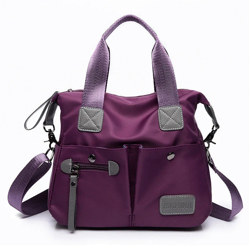 Versatile ladies handbag in various colors with multiple carry options, including handbag, shoulder bag, and crossbody styles, featuring durable construction and organizational pockets.