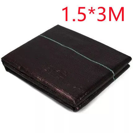 Black composite woven PE weed prevention cloth laid flat on soil.