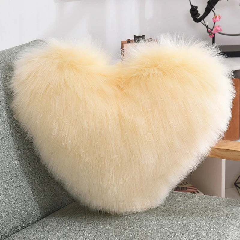 Cozy heart-shaped plush throw pillows in various colors and sizes for living room and bedroom decor