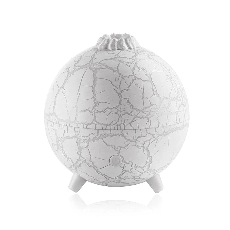 Stylish USB humidifier with essential oil diffuser, color-changing lights, and compact design for home or office use