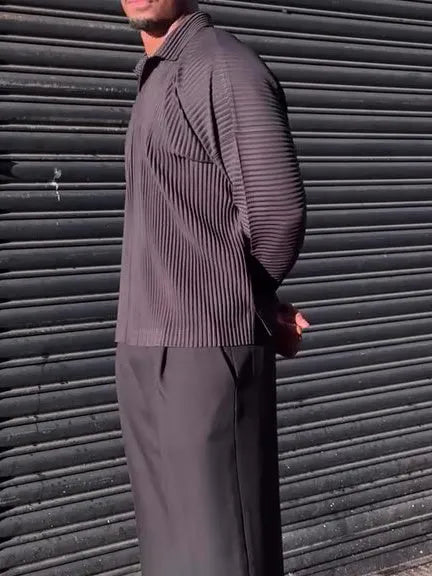 Man wearing a black pleated long-sleeve casual polyester top