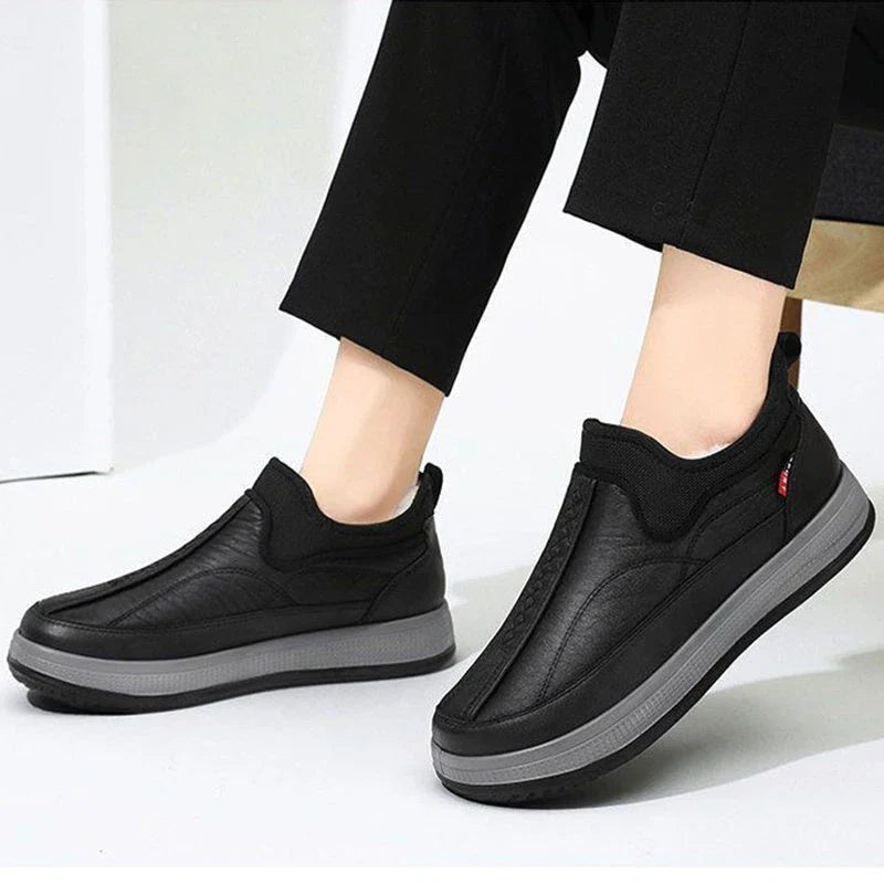 Cozy winter snow boots with fleece lining, round toe, and non-slip platform sole in black and grey colors