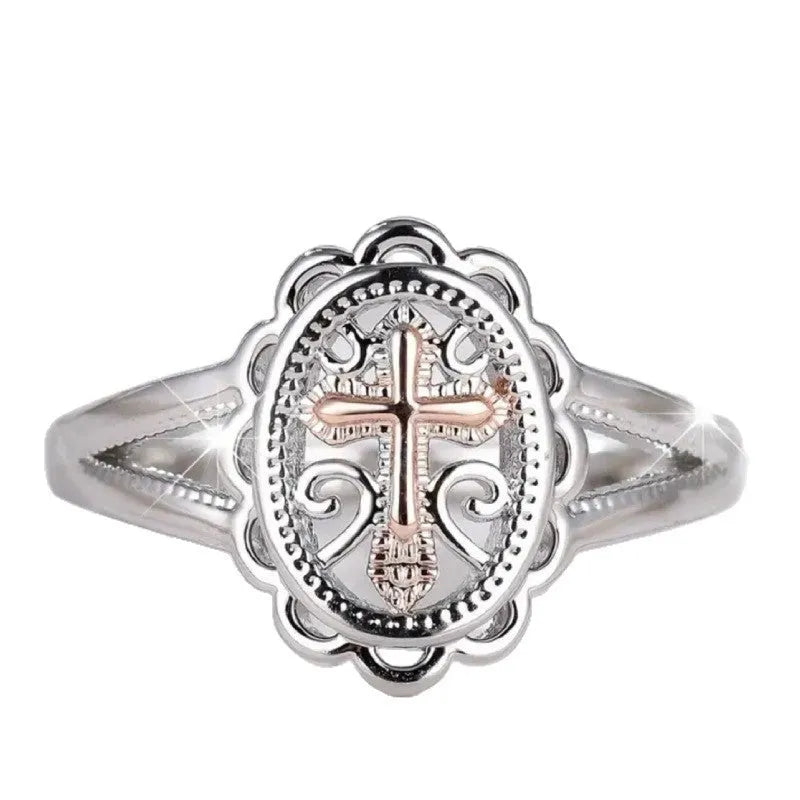 Silver colour women's cross lace ring on finger showing detailed design