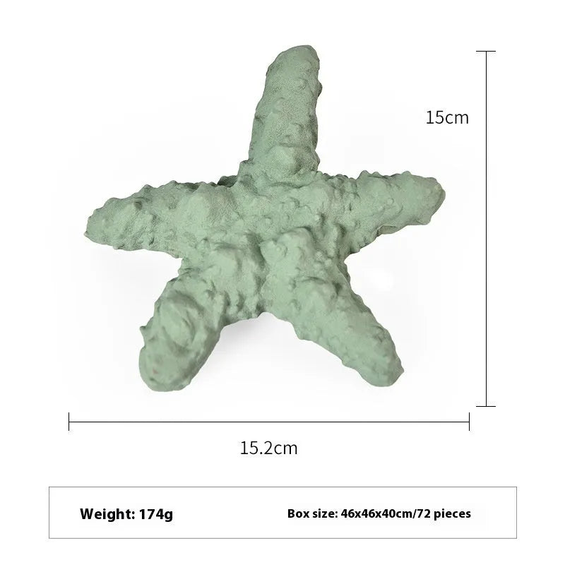 Blue rubber shark-shaped dog toy with food dispensing openings on a white background.