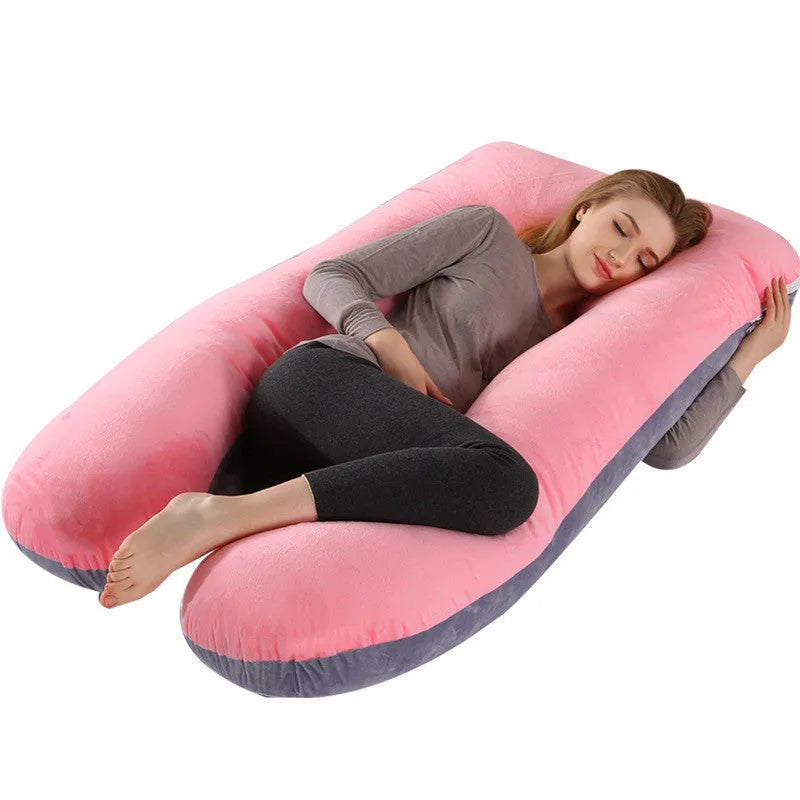 Large U-shaped pregnancy support pillow with removable cover and abdominal support belt.