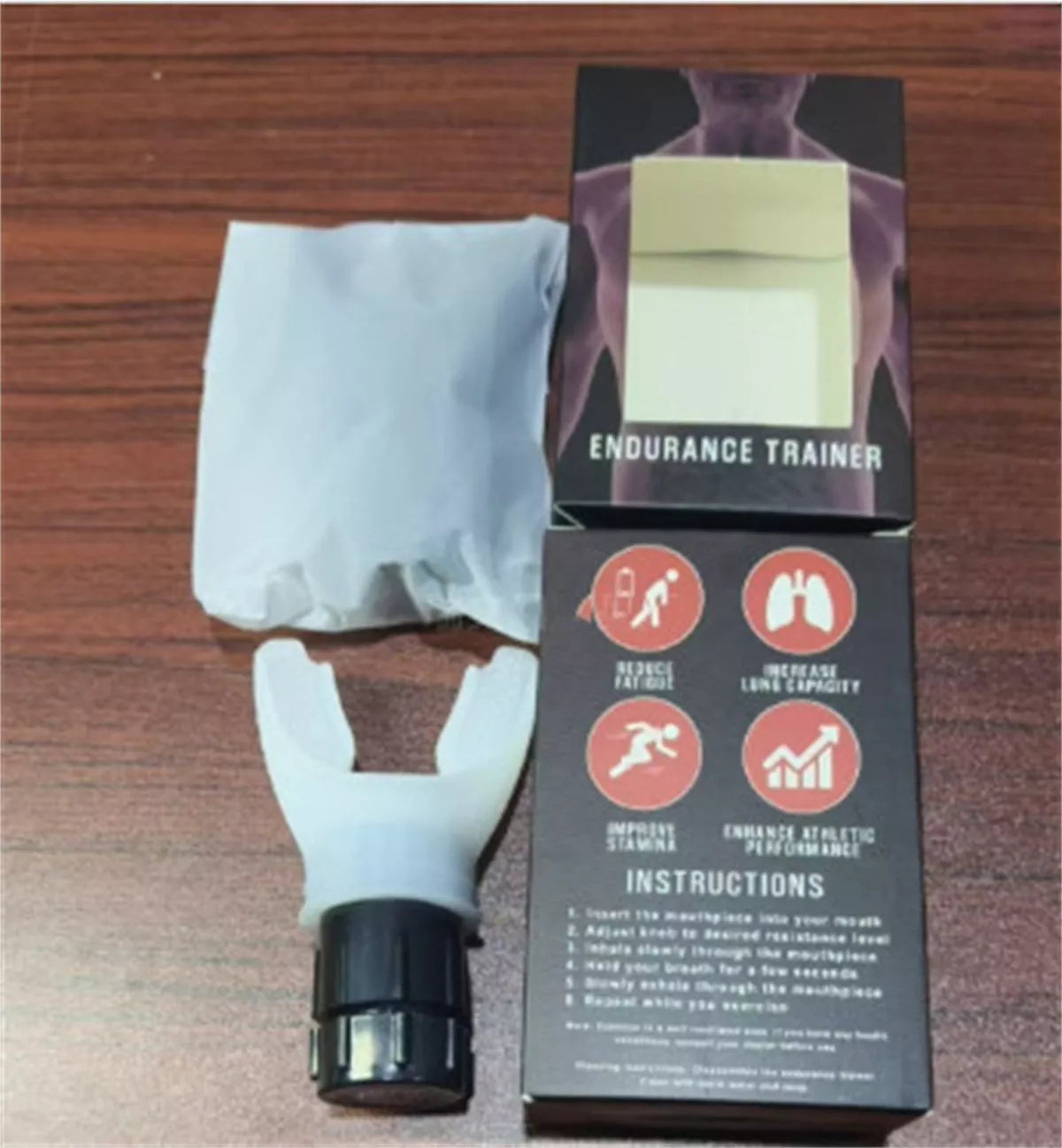 Portable breathing trainer in white and black with adjustable resistance for enhanced lung capacity