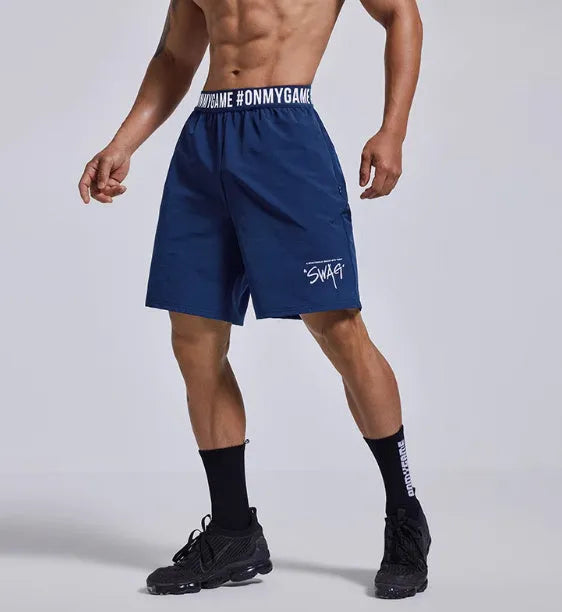 Men's loose grey sports shorts with elastic waistband and letter detail, shown front and back.