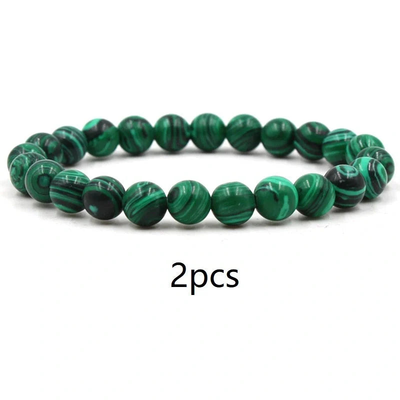 Elegant malachite stone bracelets with unique textures and patterns, perfect for a stylish accessory.