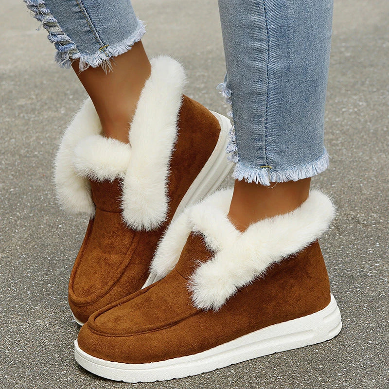 Premium warm winter snow boots for women featuring a stylish suede upper, plush lining, and durable sole for cold weather protection.