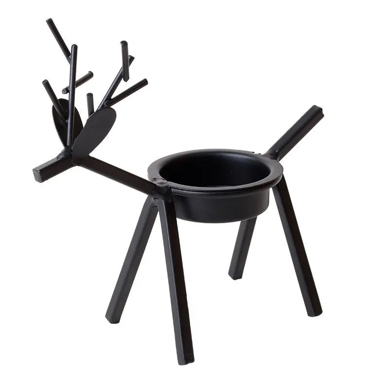 Black iron Christmas candlestick holder with elk bracket design and Santa Claus motifs
