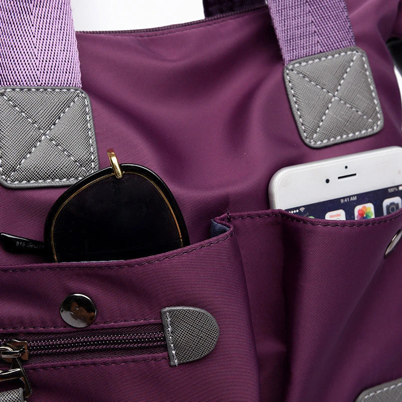 Versatile ladies handbag in various colors with multiple carry options, including handbag, shoulder bag, and crossbody styles, featuring durable construction and organizational pockets.