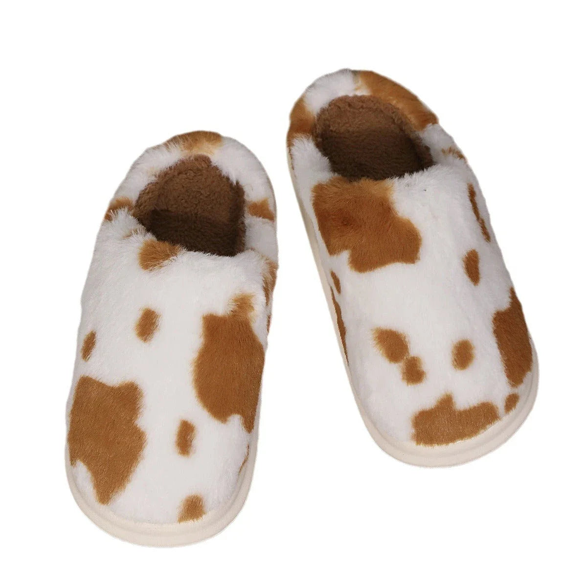 Cozy plush cow-print slippers with non-slip soles for comfortable indoor wear