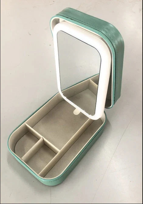 Lighted makeup mirror with adjustable LED lights, touch-controlled brightness, and integrated storage compartment