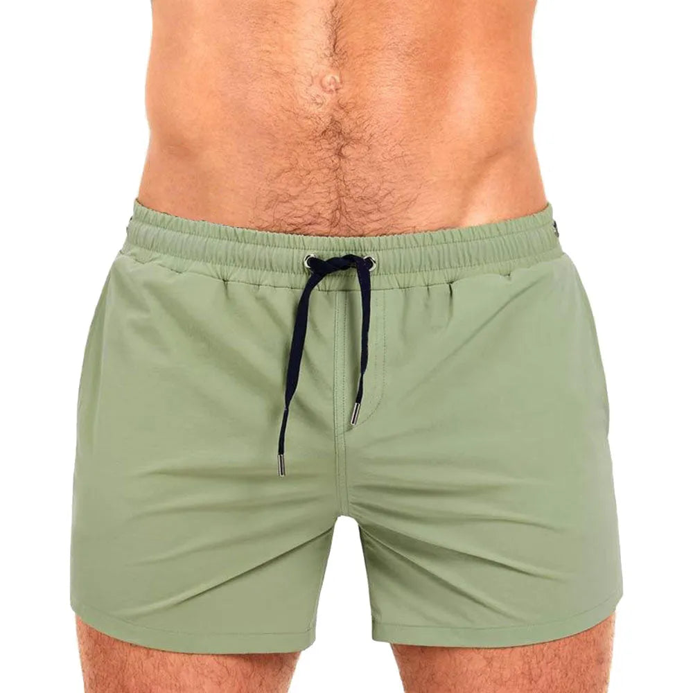 Athletic sports shorts in Army Green colour with visible mesh lining and elastic waistband with drawcord.