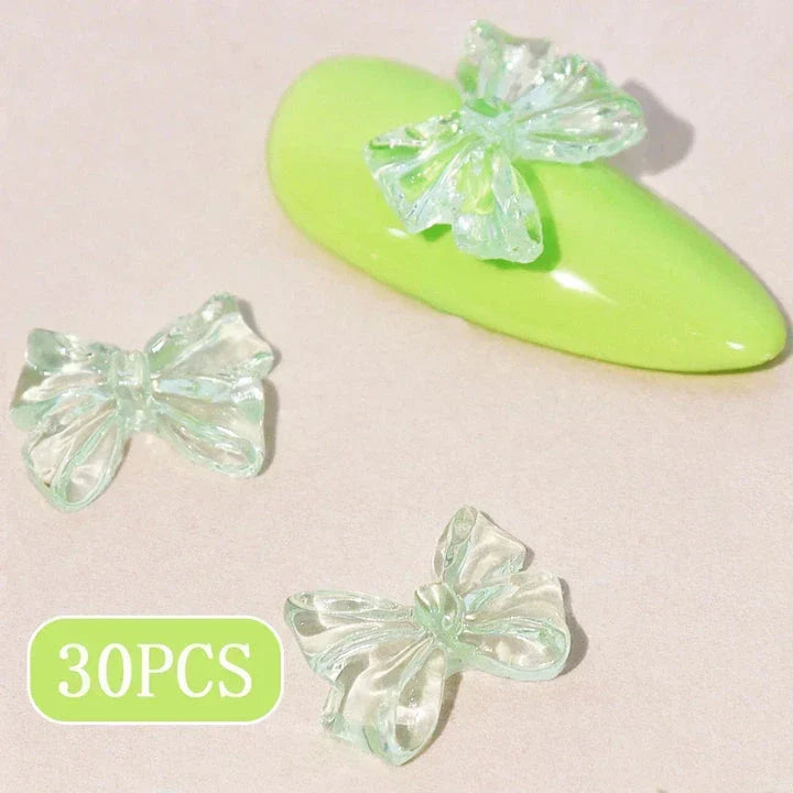 Candy pink bow-shaped 3D resin nail charms for adding a cute and playful touch to your manicure