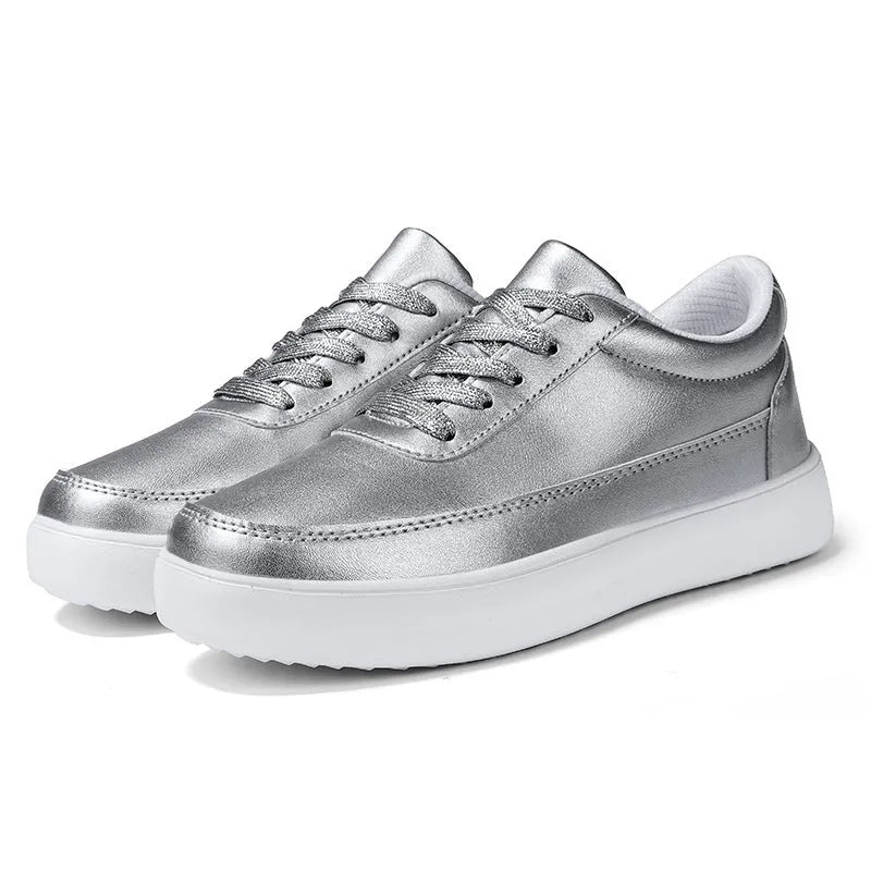 Women's lightweight leather flat casual shoes in gold colour with front lace-up design on a white background