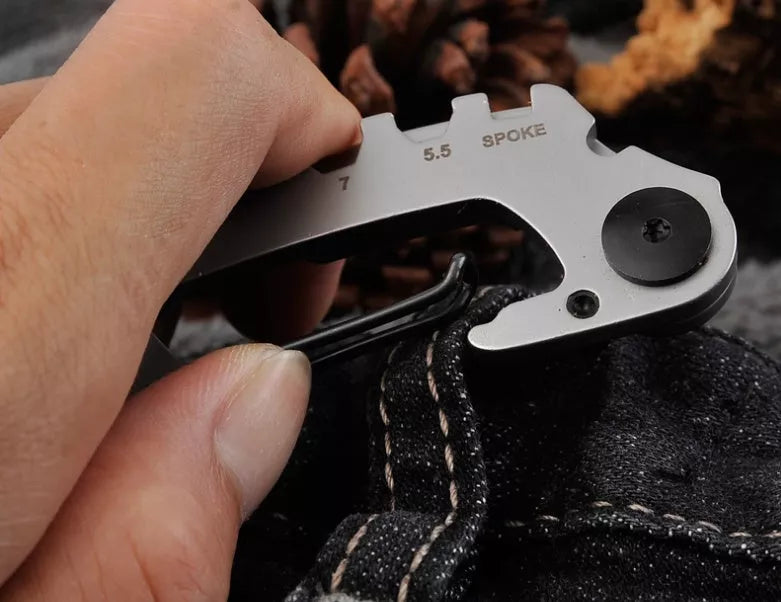 Stainless steel multi-function keychain with geometric gadgets including screwdrivers and hex wrenches