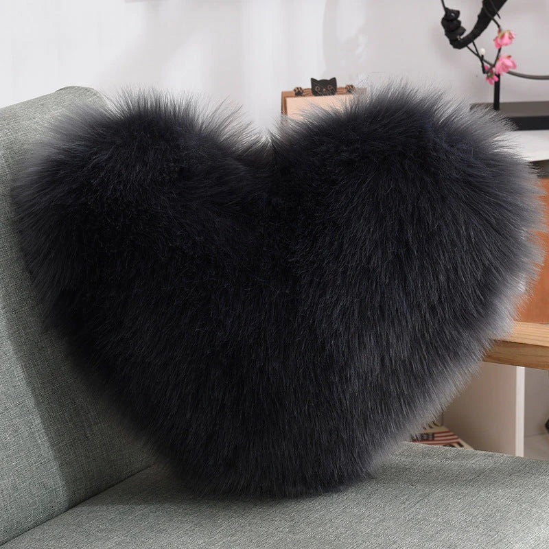 Cozy heart-shaped plush throw pillows in various colors and sizes for living room and bedroom decor