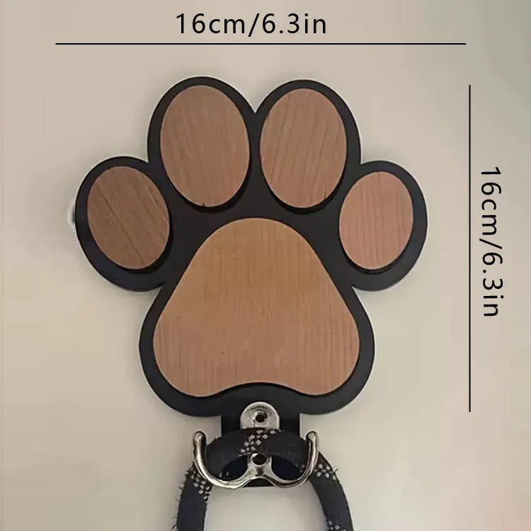 Black and white wooden paw print shaped wall hook for hanging keys or coats