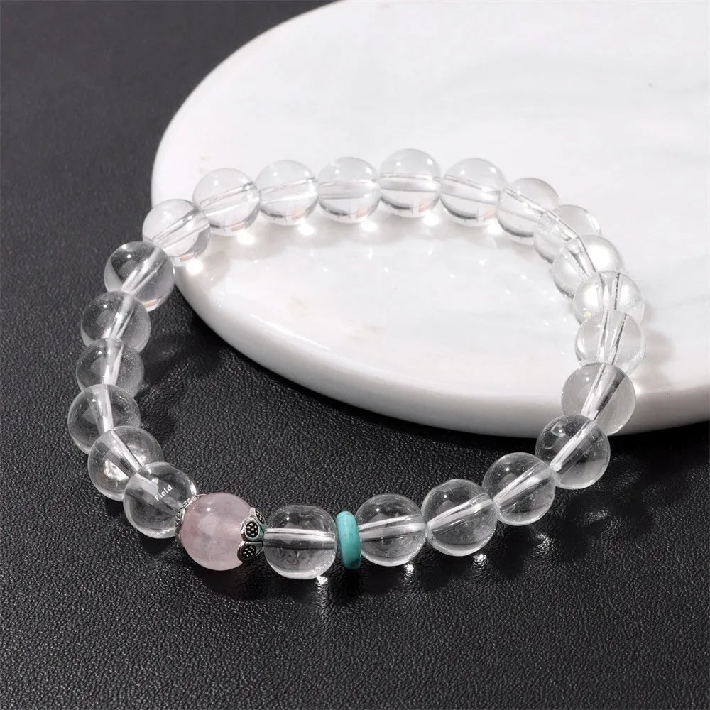 Handmade white crystal bracelet with 8mm beads and U-shaped design on wrist