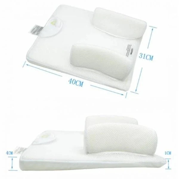 Newborn baby sleeping comfortably on the Baby Sleep Fixed Position & Anti Roll Pillow, with elevated head and air vent bumpers for optimal breathing and cooling.