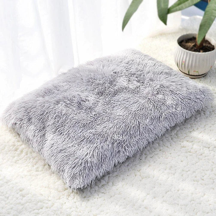 A cozy and plush pet bed in various color options, designed to provide ultimate comfort and relaxation for your furry friend.
