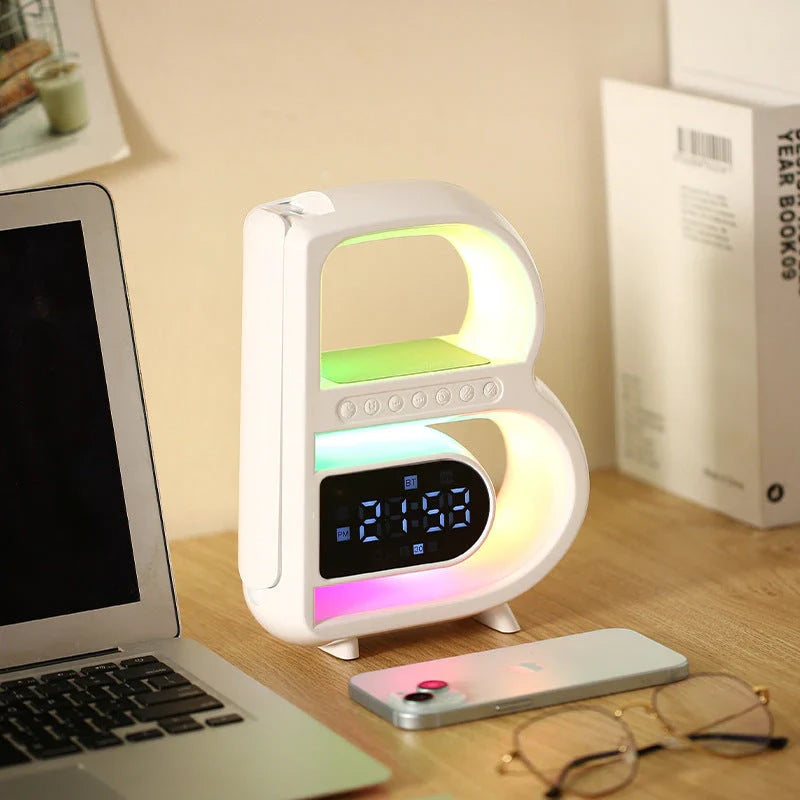B-shaped Bluetooth speaker with wireless charging, adjustable lighting, and alarm clock functionality