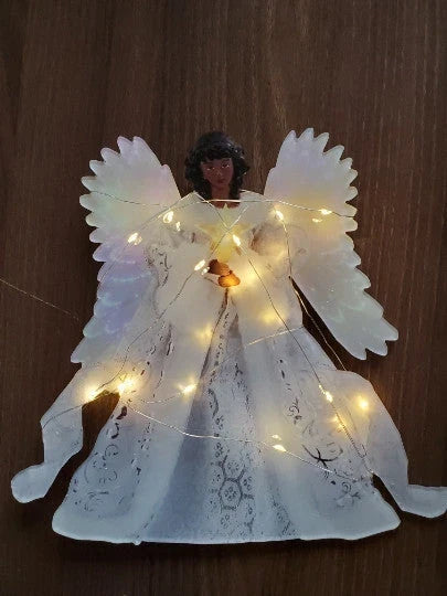 Radiant angel Christmas tree topper with glowing LED lights, creating a warm and enchanting holiday decoration