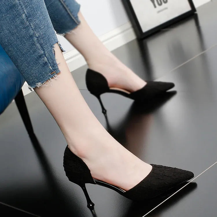 Black pointed-toe stiletto high heel shoes with a 6-8cm heel on a plain background.