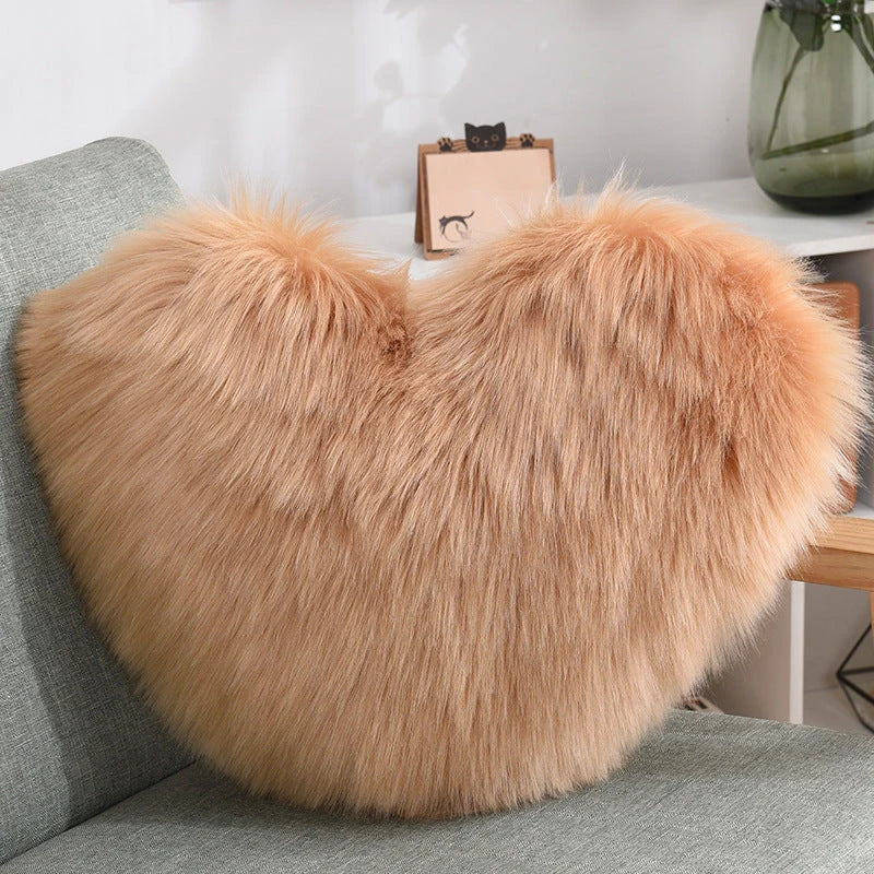 Cozy heart-shaped plush throw pillows in various colors and sizes for living room and bedroom decor