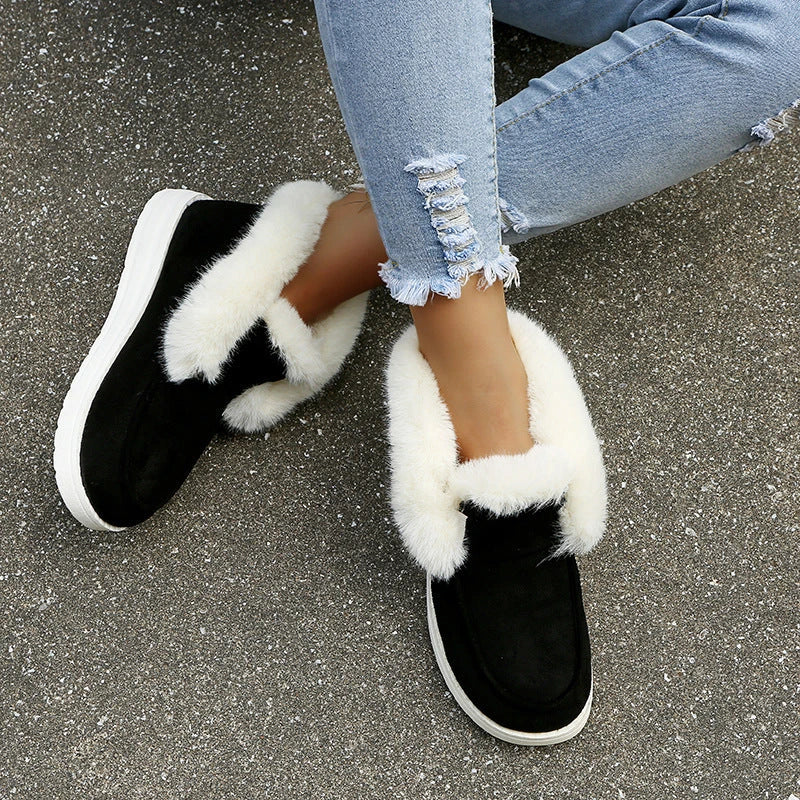Premium warm winter snow boots for women featuring a stylish suede upper, plush lining, and durable sole for cold weather protection.