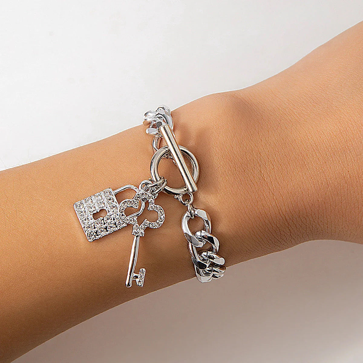 Stylish lock and key pendant necklace with a delicate chain, available in a variety of colors and materials