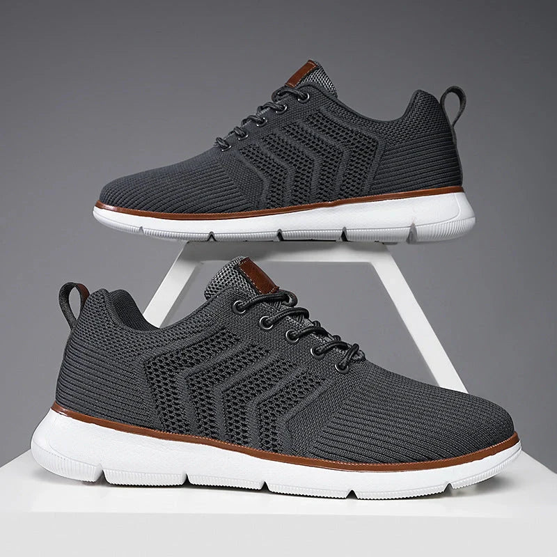 Men's black lace-up mesh sneakers with woven detail for casual and sports wear
