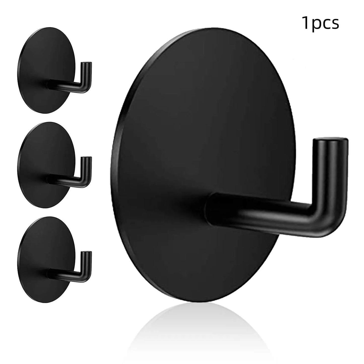 Two round stainless steel self-adhesive hooks, one black and one polished, for no-drill bathroom and kitchen hanging.