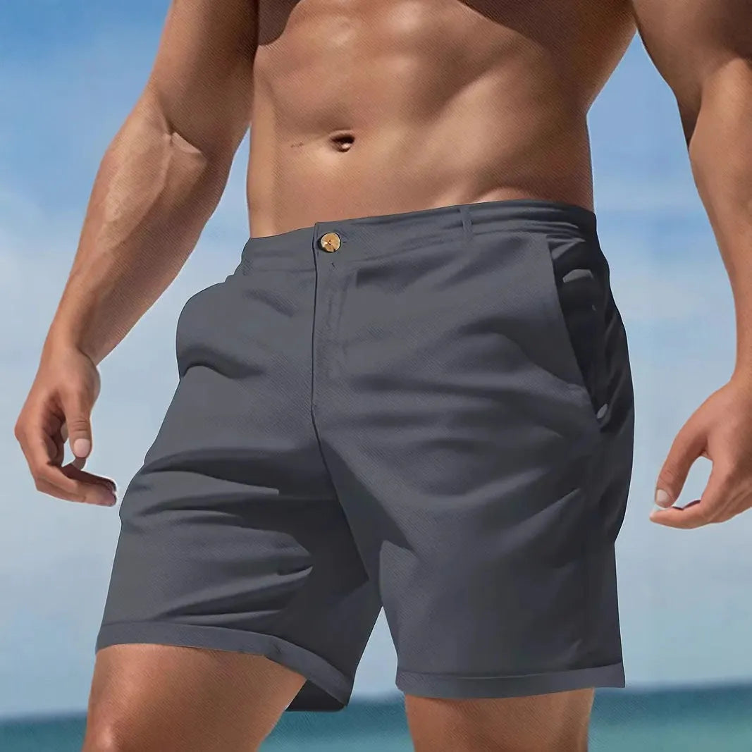 Men's solid colour cotton blend retro shorts in straight leg fit on a white background.