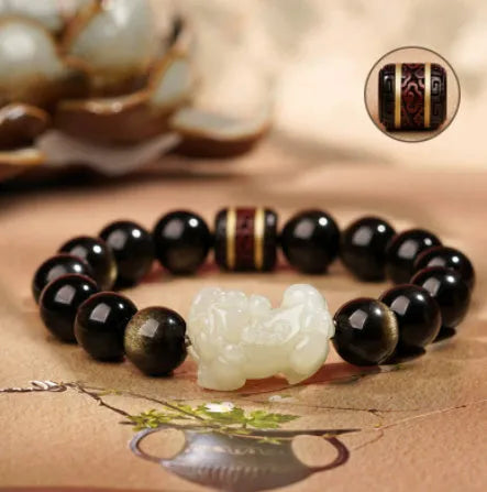 Rainbow eye obsidian beaded bracelet in gold obsidian and jade pi xiu colours.