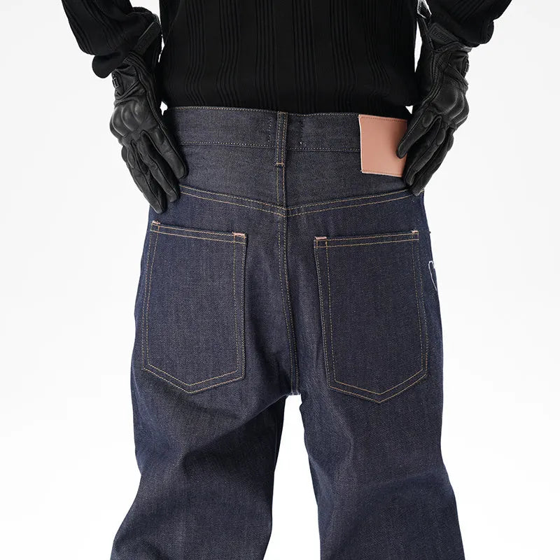 Man wearing dark blue loose-fit straight-leg denim jeans, showcasing the casual relaxed silhouette.
