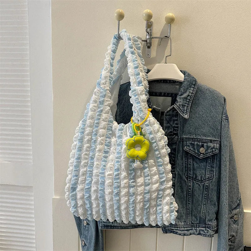 Women's pleated bubble crossbody bag in vertical square shape with pendant accessory